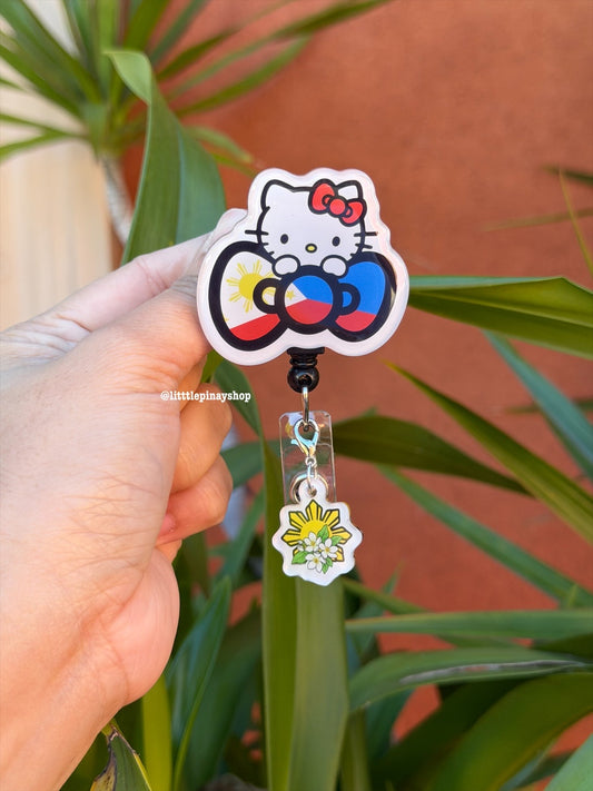 Kitty Flag Bow ID Badge Reel w/ Sun Sampaguita Dangling Charm ( Alligator Clip )
