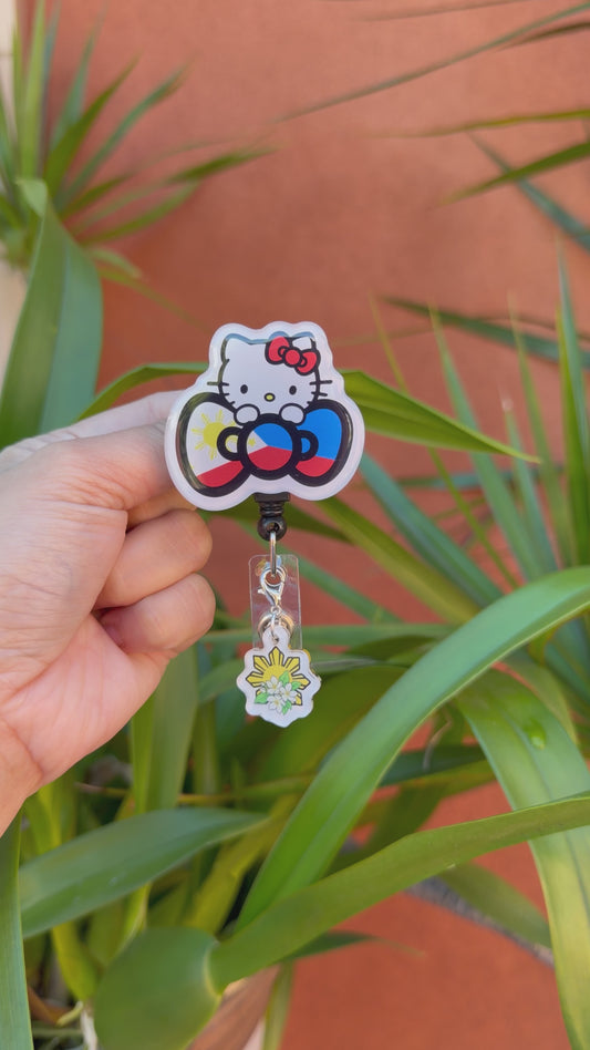Kitty Flag Bow ID Badge Reel w/ Sun Sampaguita Dangling Charm ( Alligator Clip )
